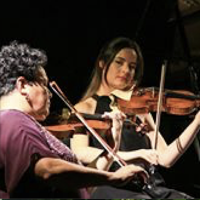 Wilma Smith and Amalia Hall playing violins