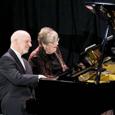 Michael Houstoun and Diedre Irons playing a piano duet