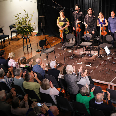 Artist acknowledge applause from the audience at the 2024 Festival