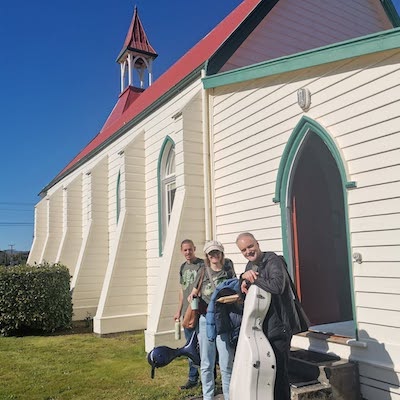 Artists enjoying the sun outside the rehearsal rooms at First Church