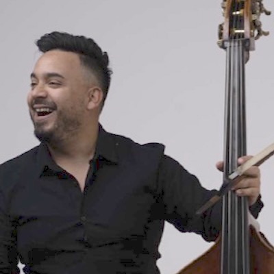 Oscar Luque holding his double bass
