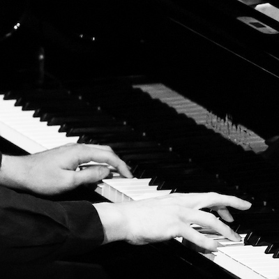 Hands on the Schimmel piano used in MMF Festivals