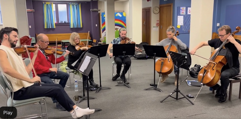 A group of musicians rehearsing for the 2023 Festival