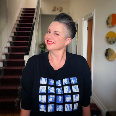 Victoria Kelly wearing a t-shirt she made featuring NZ women composers