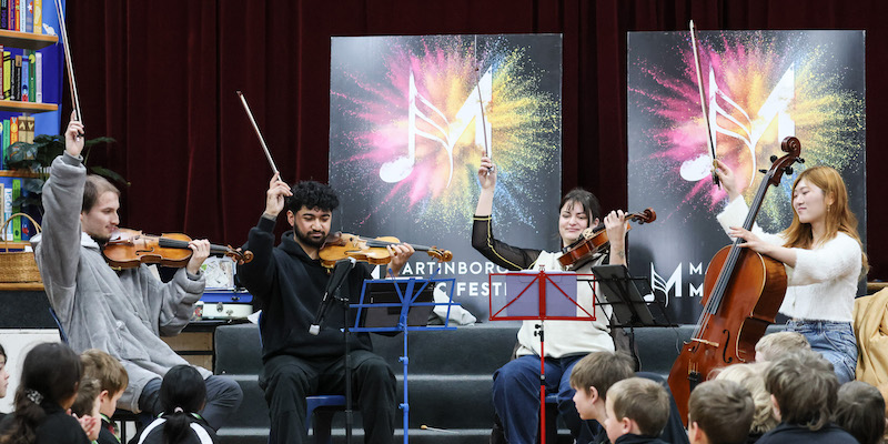 The Druz'ya Quartet finishing a performance with a flourish at the 2024 schools concert