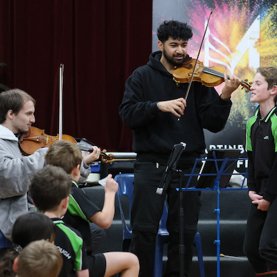 Members of the Druz'ya Quartet finteracting with students at a 2024 schools concert