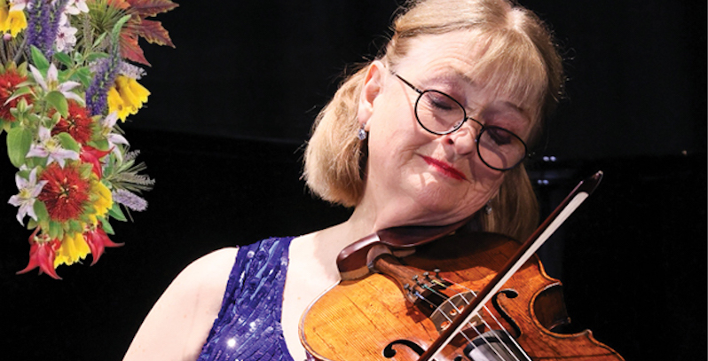 Gillian Ansell playing her viola The image is decorated with NZ flowers