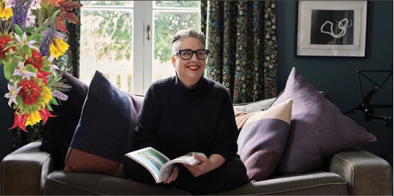 Victoria Kelly sitting on a sofa with a book